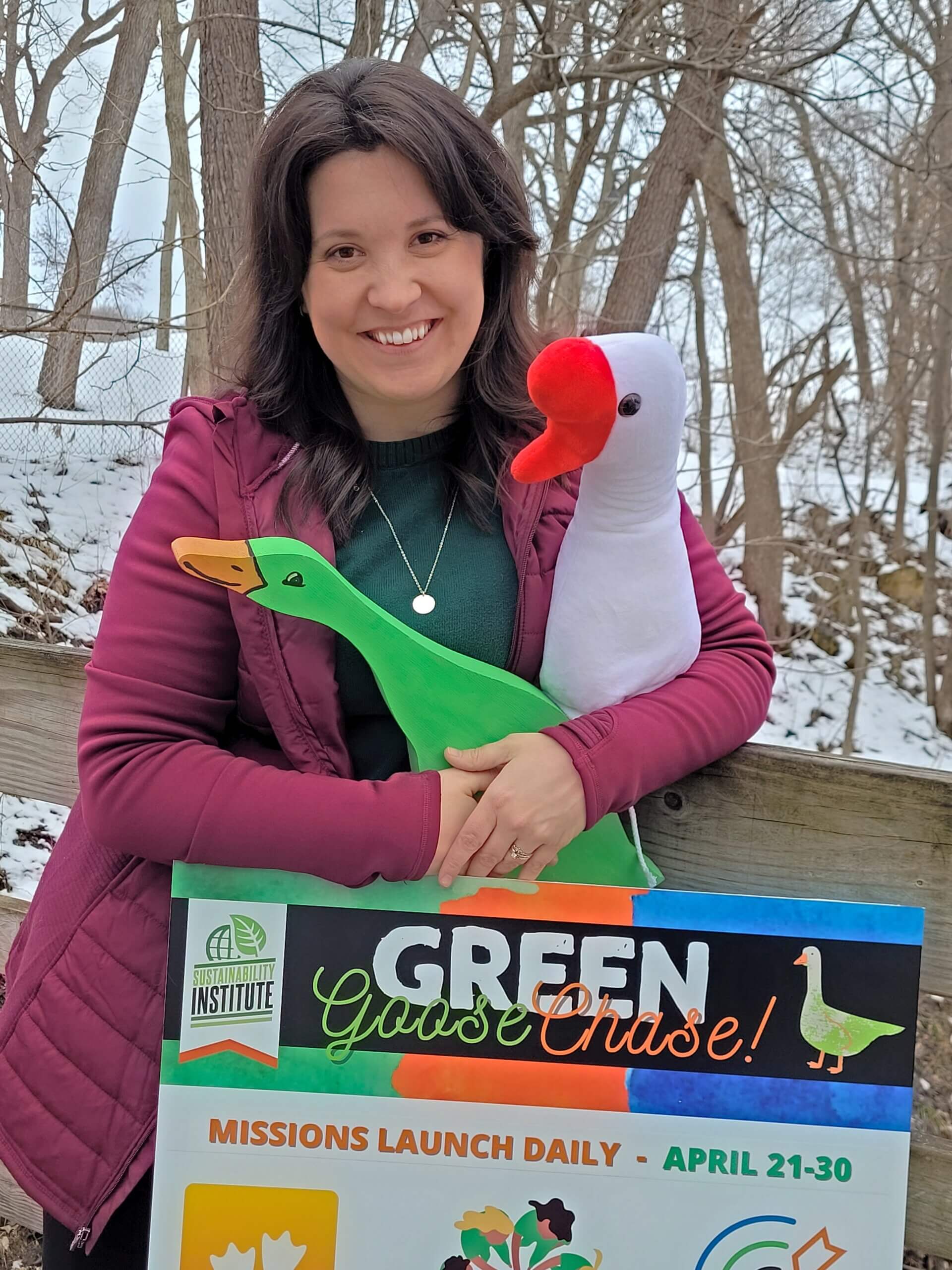 woman holding goose stuffies