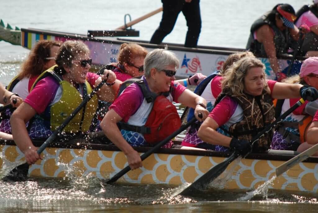 women racing in a dragon boat