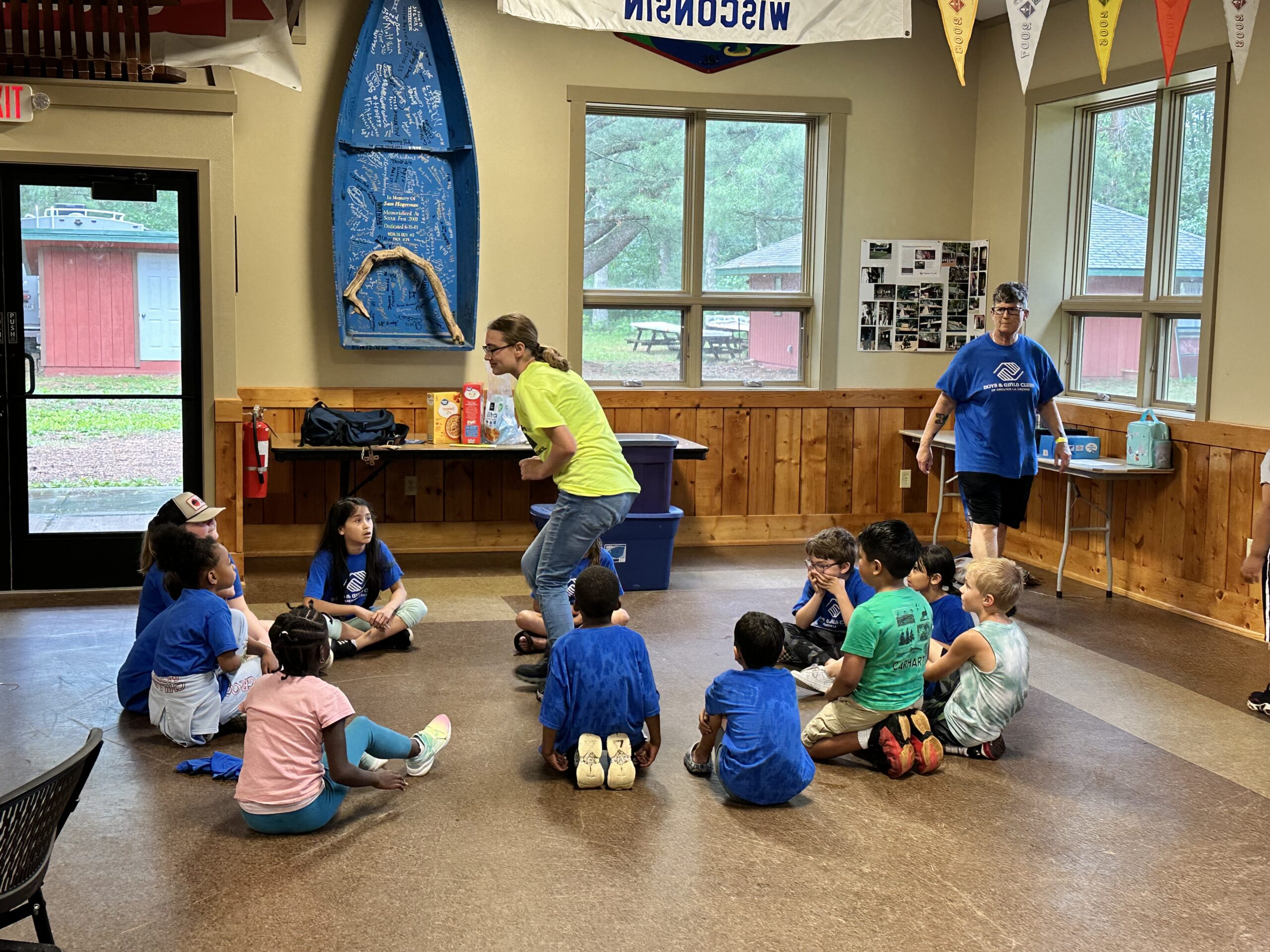 children enjoying indoor pop-up camp activity as it rains outside