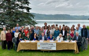group of people with Mississippi River in background