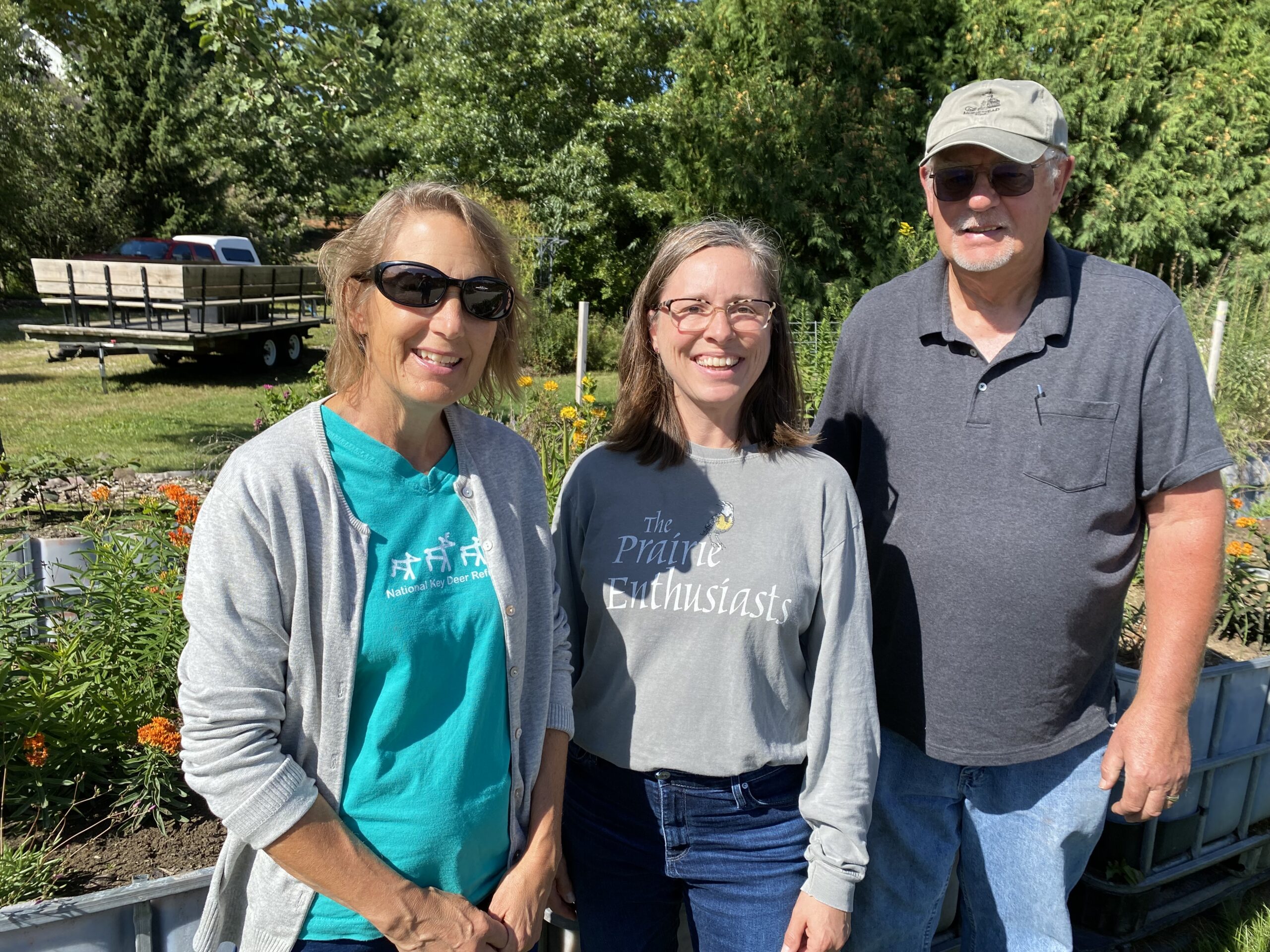 Prairie Enthusiasts Executive Director Debra Behrens with two volunteers.