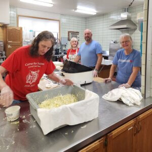 Volunteers prepare a fresh meal at Our Savior’s Lutheran Church in La Crosse.